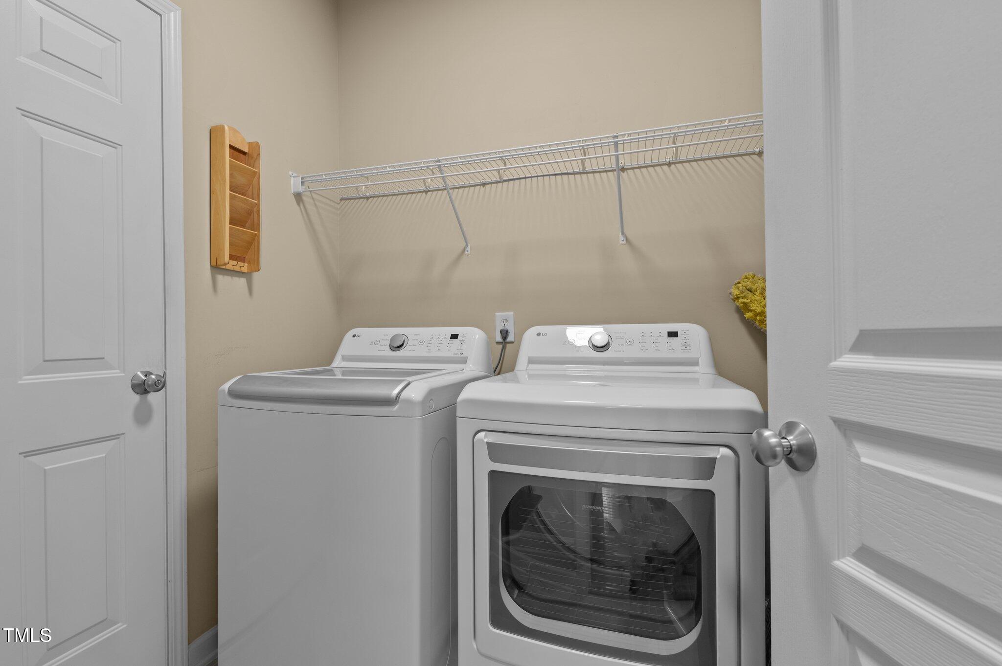 9117 Cornwell Drive Wake Forest, NC 27587 - Photo 39 of 50 a utility room with dryer and washer