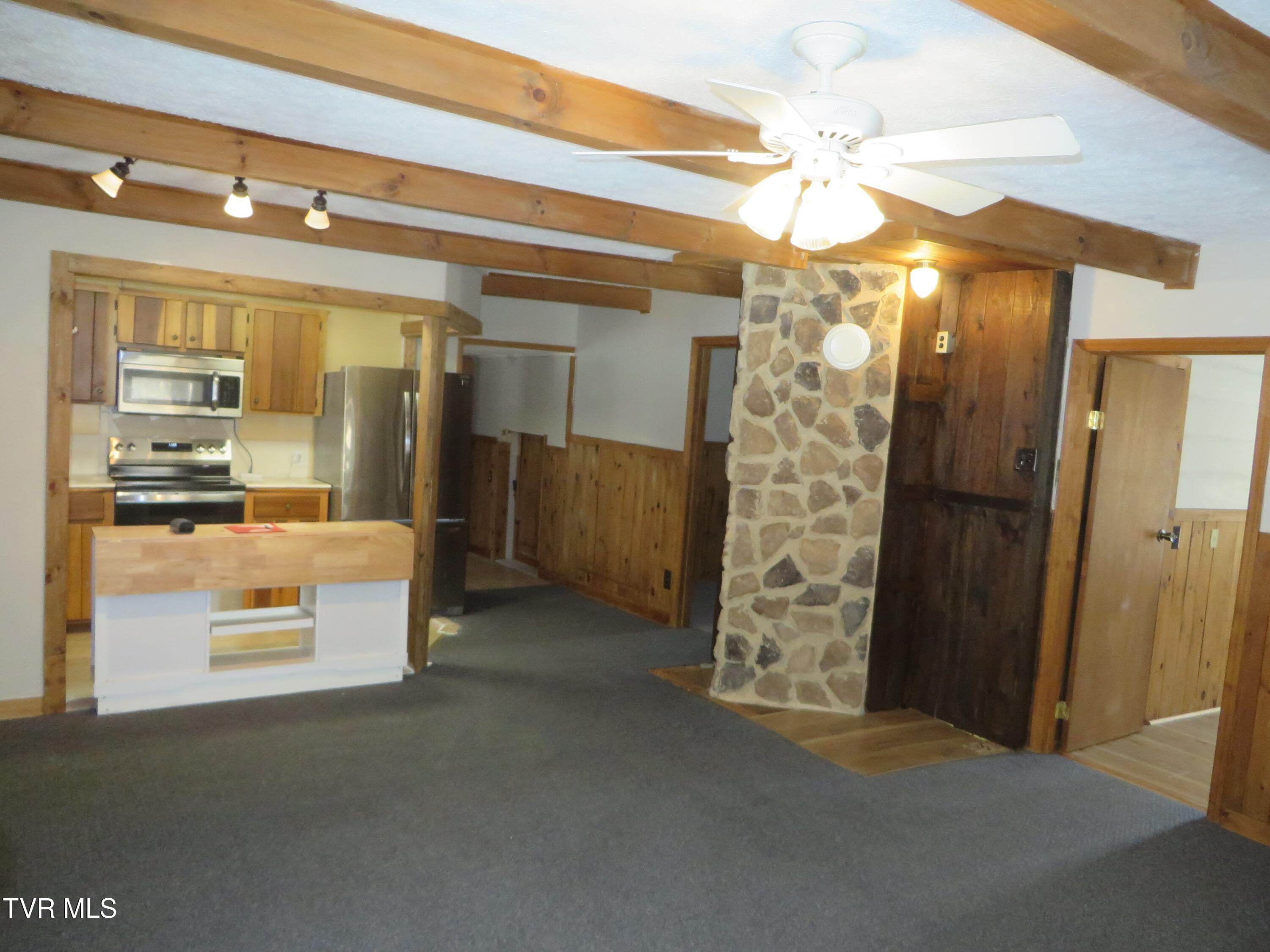 492 Forge Creek Road Mountain City, TN 37683 - Photo 23 of 44 Living room with chimney-kitchen