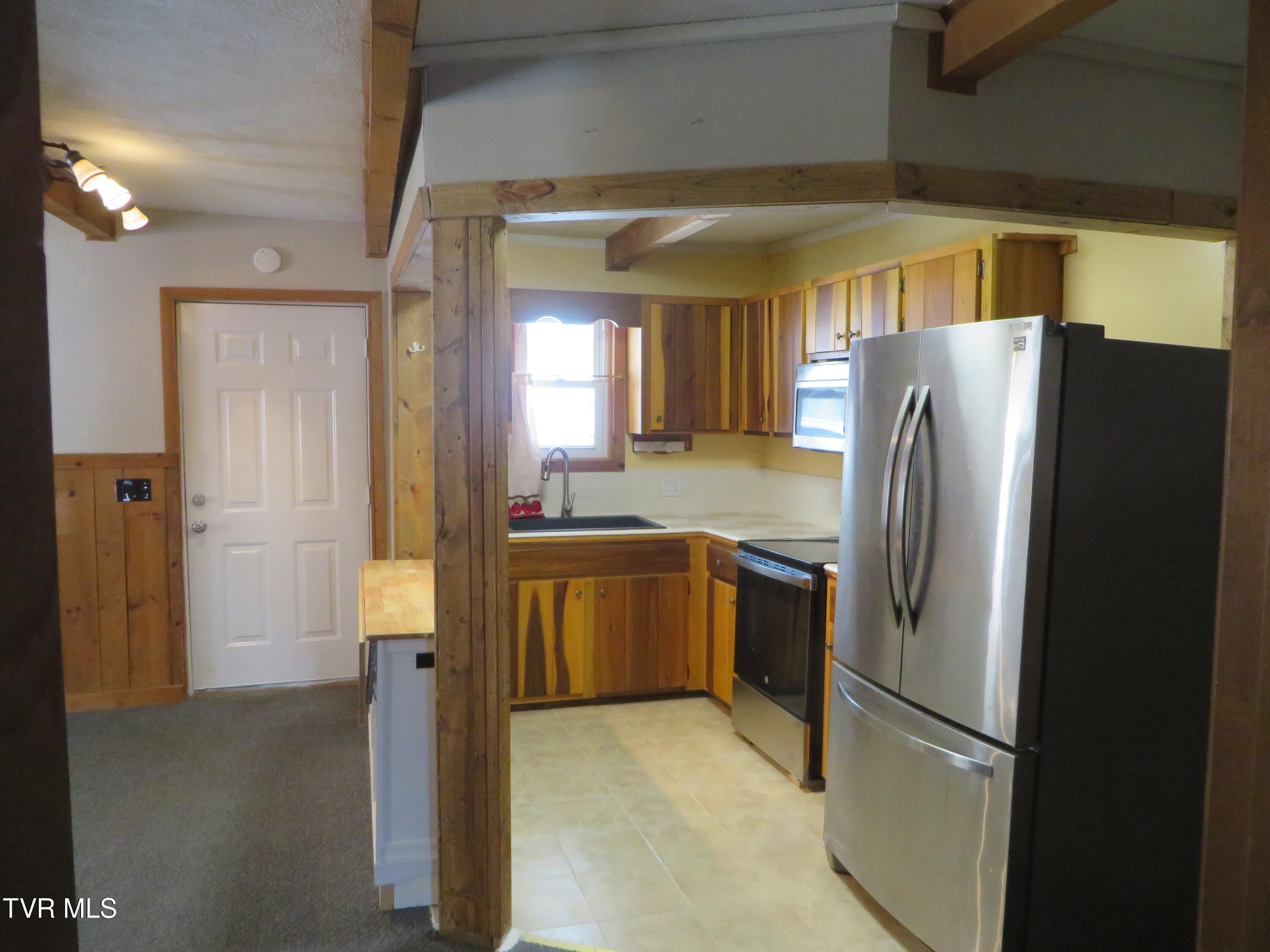 492 Forge Creek Road Mountain City, TN 37683 - Photo 28 of 44 Side door - kitchen cabs