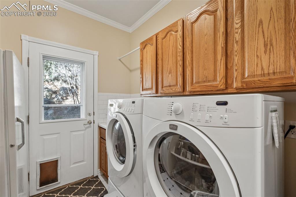 5440 Setters Way Colorado Springs, CO 80919 - Photo 13 of 40 a utility room with dryer and washer