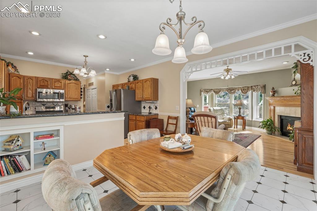 5440 Setters Way Colorado Springs, CO 80919 - Photo 19 of 40 a view of a dining room with furniture