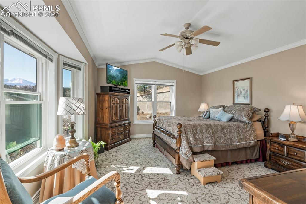 5440 Setters Way Colorado Springs, CO 80919 - Photo 24 of 40 a bedroom with a bed and a flat screen tv