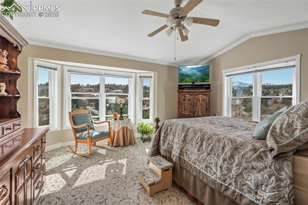 5440 Setters Way Colorado Springs, CO 80919 - Photo 25 of 40 a bed sitting in a spacious bedroom next to a window