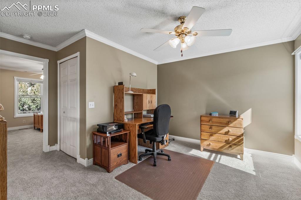 5440 Setters Way Colorado Springs, CO 80919 - Photo 27 of 40 a view of a workspace with furniture
