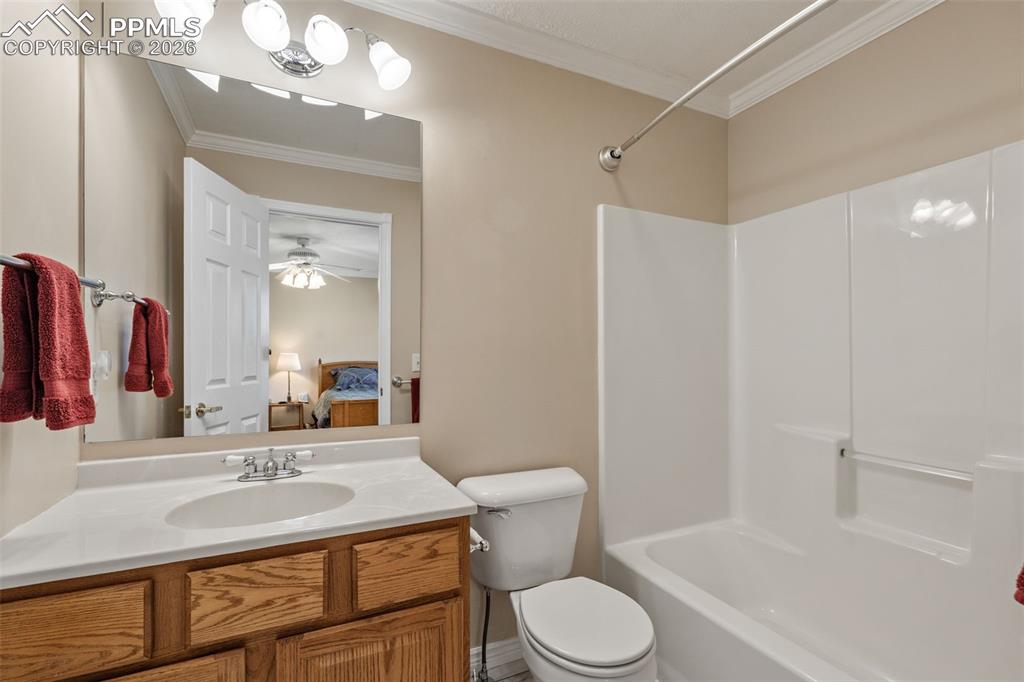 5440 Setters Way Colorado Springs, CO 80919 - Photo 29 of 40 a bathroom with a sink toilet vanity and shower