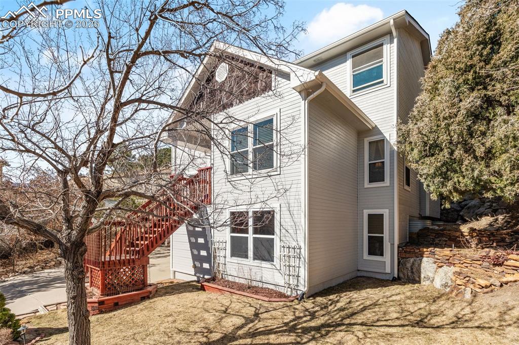 5440 Setters Way Colorado Springs, CO 80919 - Photo 6 of 40 a view of a house with a large tree