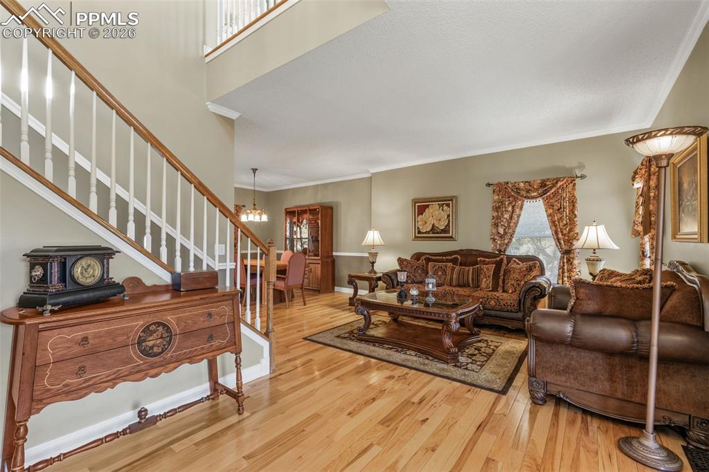 5440 Setters Way Colorado Springs, CO 80919 - Photo 9 of 40 a living room with furniture and wooden floor