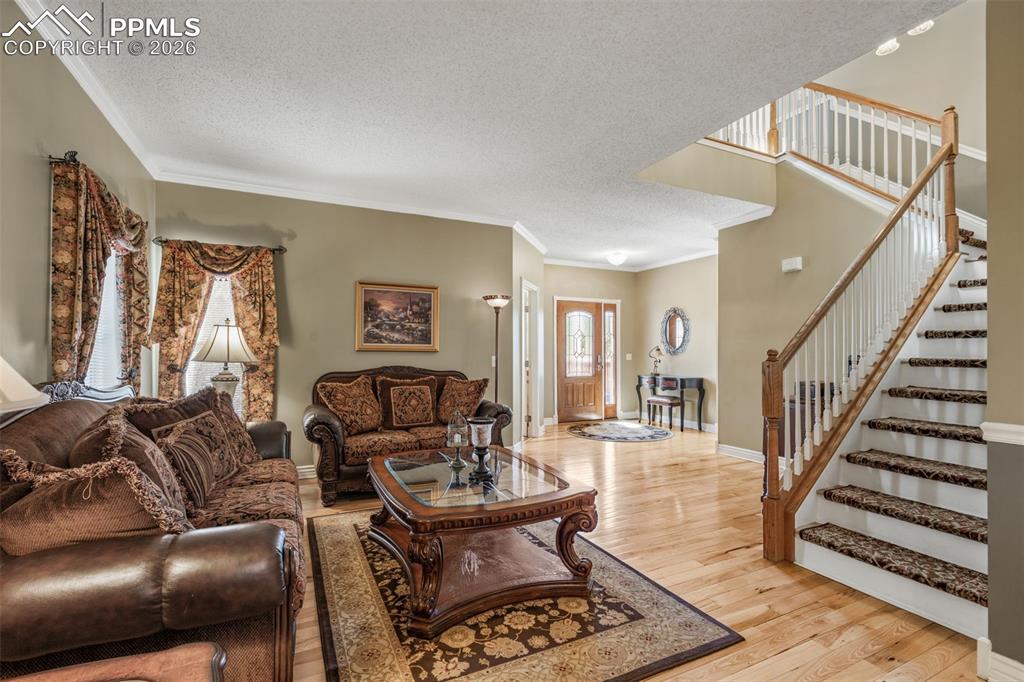 5440 Setters Way Colorado Springs, CO 80919 - Photo 10 of 40 a living room with furniture and wooden floor