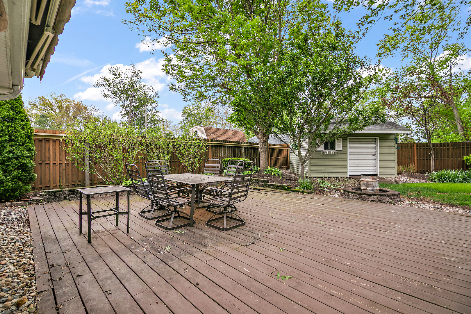 2 Jan Avenue Kankakee, IL 60901 - Photo 16 of 19 a view of a patio with table and chairs and wooden floor
