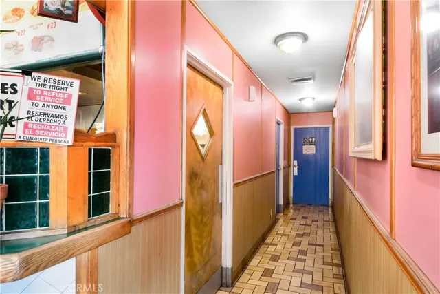 a view of building with cars parked