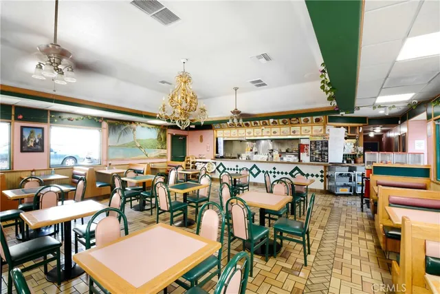 a living room with lots of furniture and a chandelier