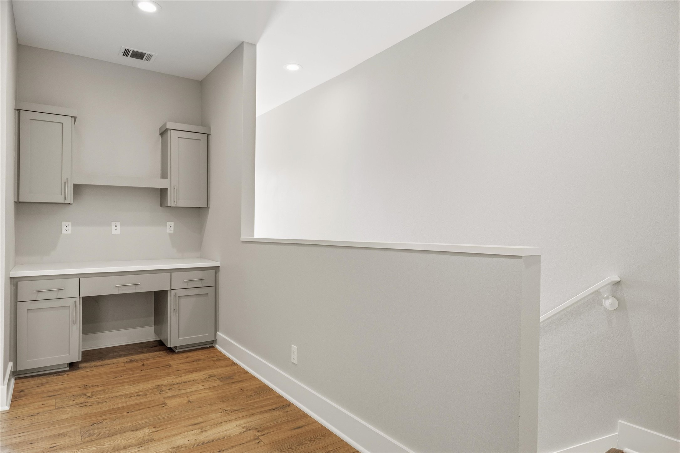 1210 Stobaugh Street, Unit B Austin, TX 78757 - Photo 15 of 40 Functional built-in desk with ample cabinetry for a dedicated workspace.