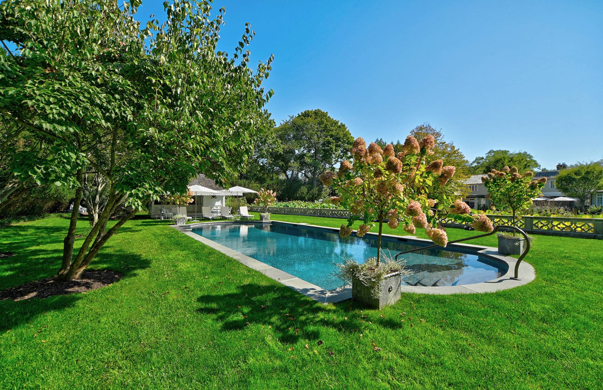 63 Middle Lane East Hampton, NY 11937 - Photo 12 of 39 a view of a backyard with swimming pool