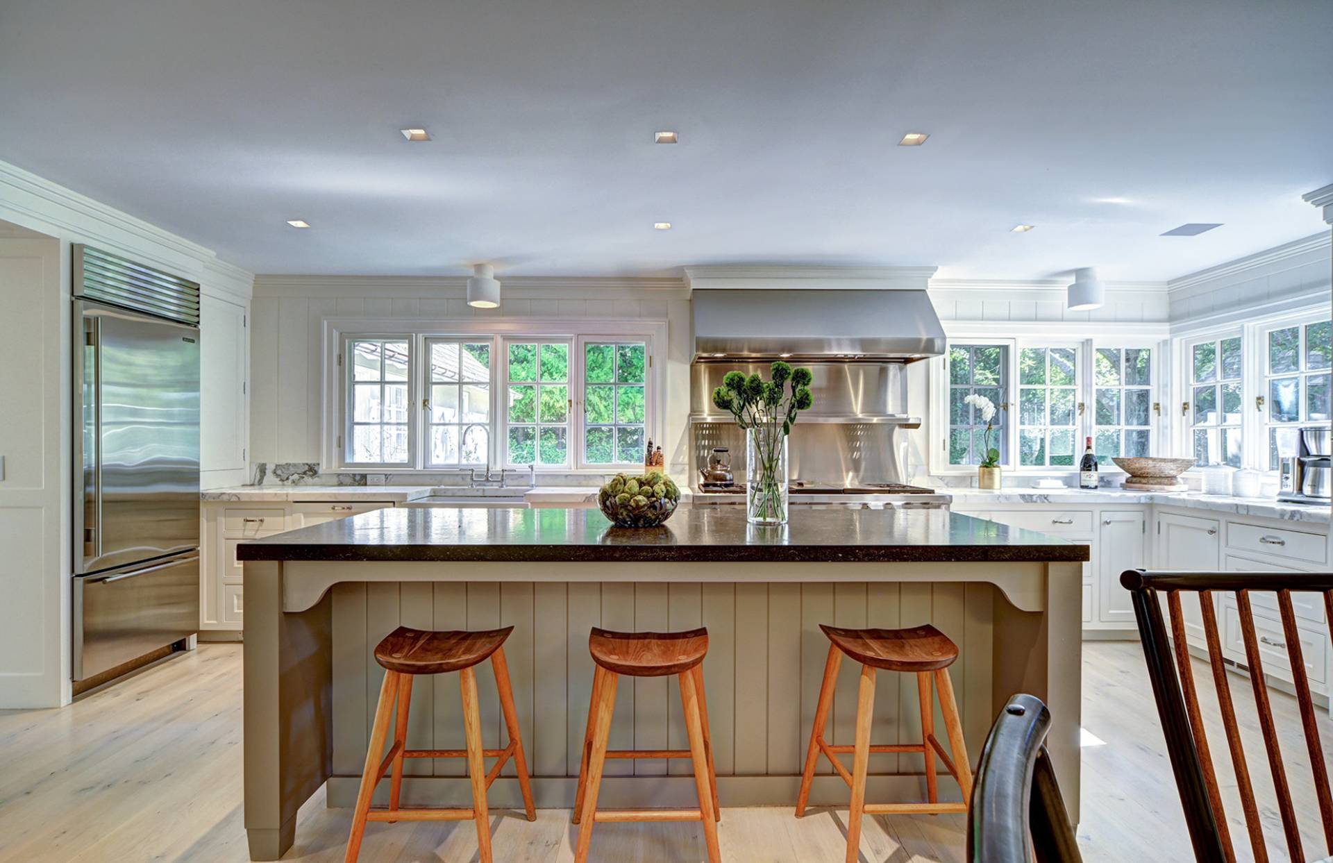 63 Middle Lane East Hampton, NY 11937 - Photo 18 of 39 a kitchen with stainless steel appliances granite countertop a stove a sink and a refrigerator