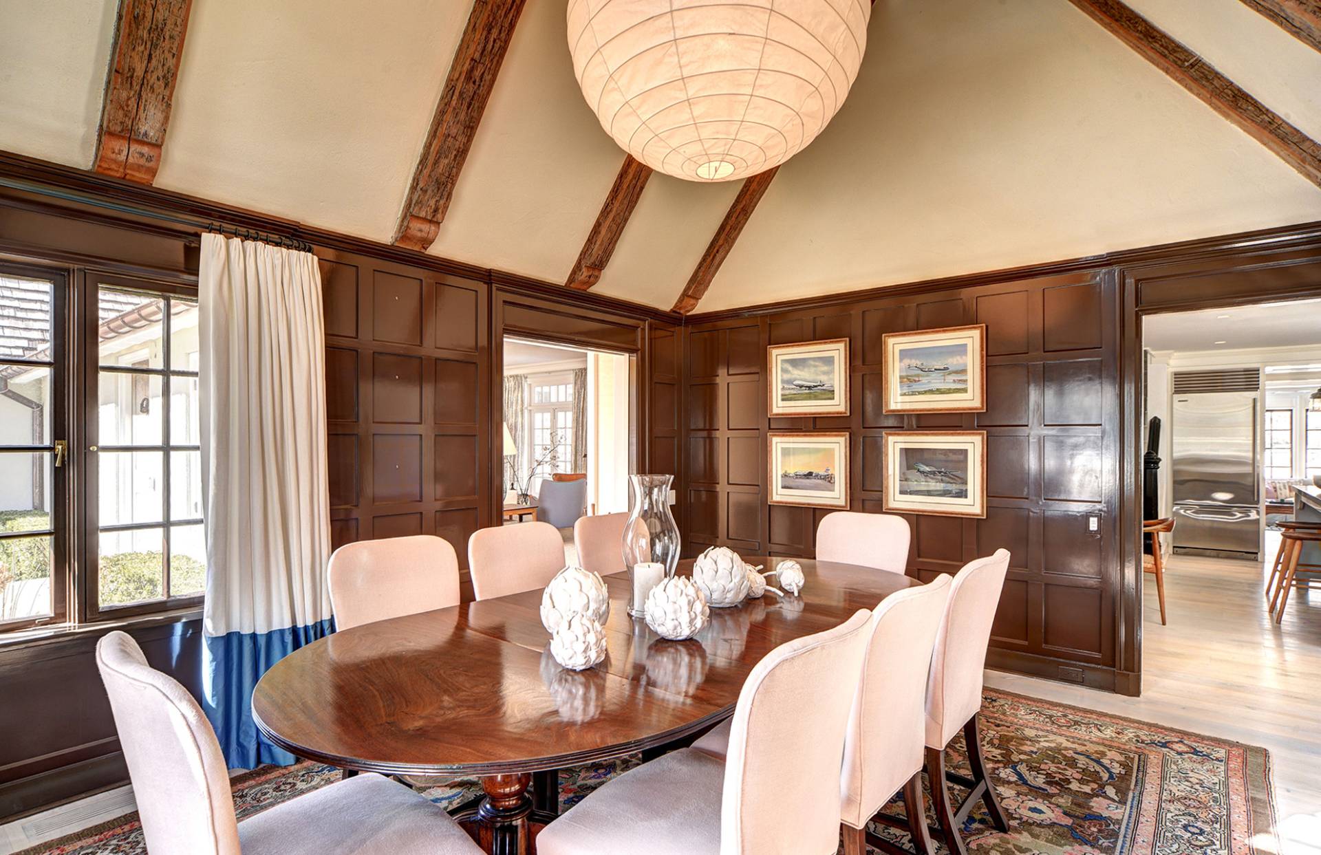 63 Middle Lane East Hampton, NY 11937 - Photo 22 of 39 a dining room with furniture a chandelier and wooden floor