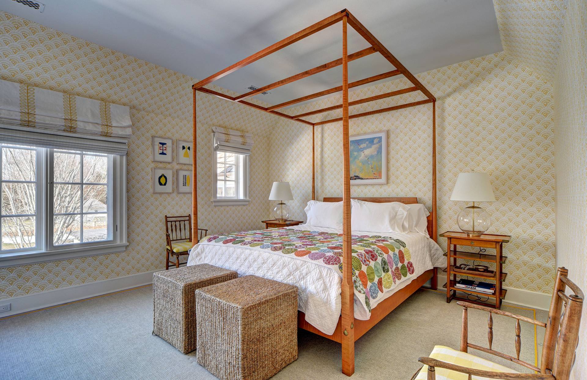 63 Middle Lane East Hampton, NY 11937 - Photo 33 of 39 a bedroom with a bed next to a window with a bookshelf