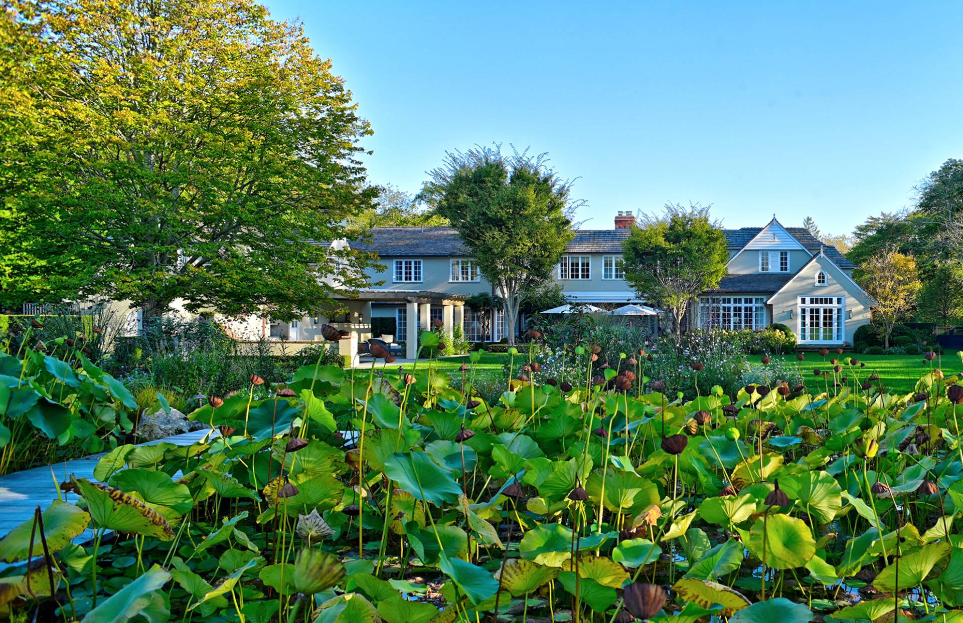 63 Middle Lane East Hampton, NY 11937 - Photo 4 of 39 a front view of a house with a yard