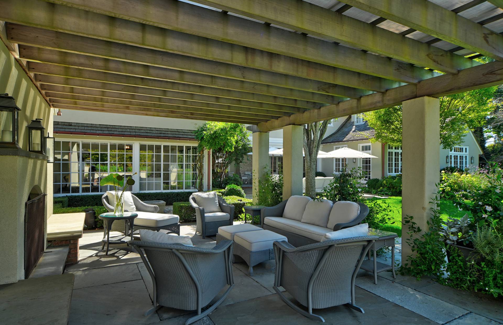 63 Middle Lane East Hampton, NY 11937 - Photo 8 of 39 a view of patio with couches and chairs under an umbrella