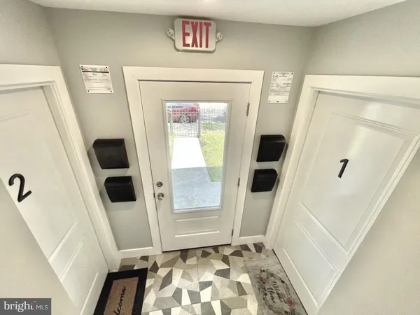 a view of an entryway with a door