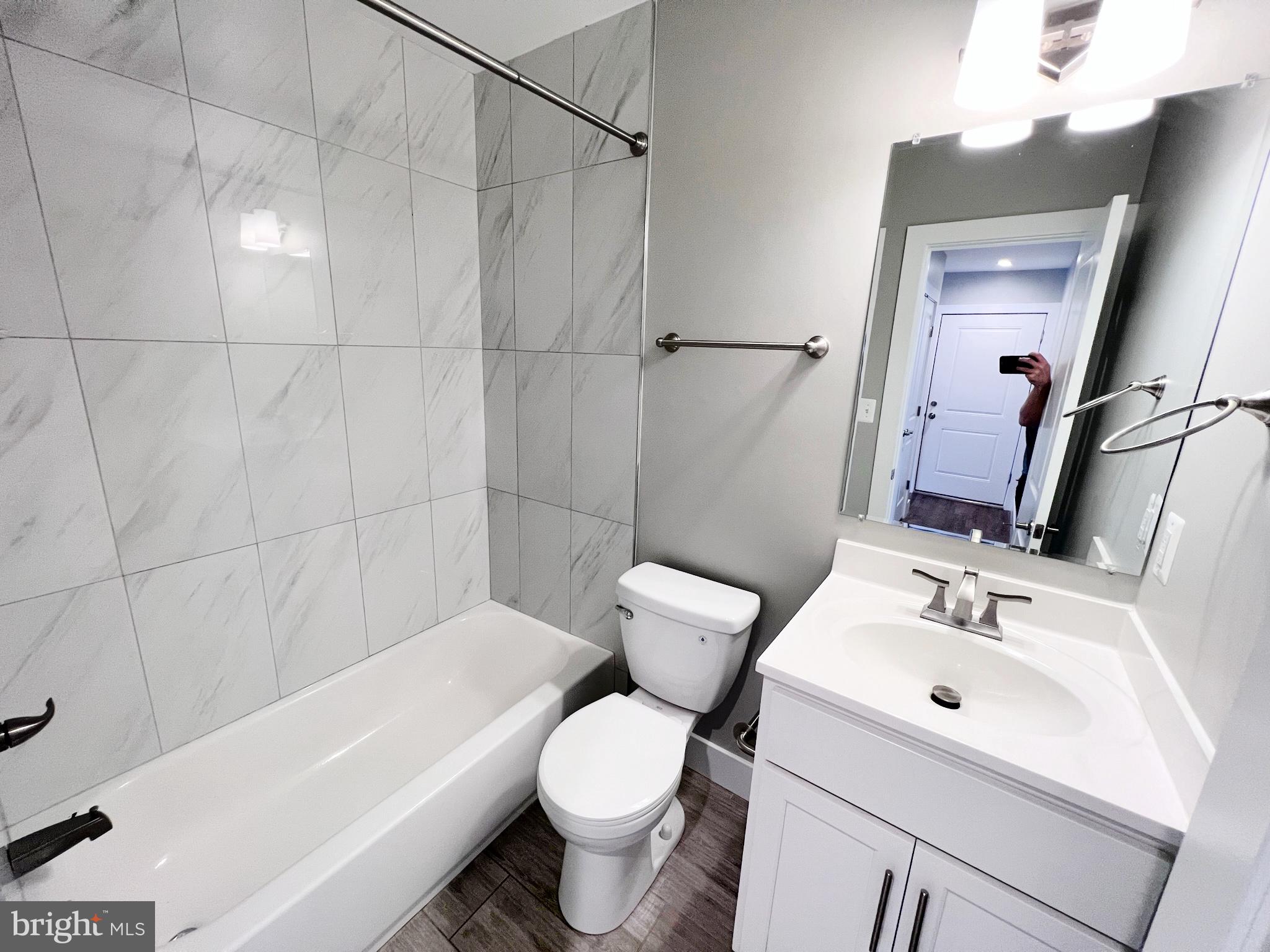 447 Orange Street Southeast, Unit 3 Washington, DC 20032 - Photo 5 of 14 a bathroom with a sink toilet and shower