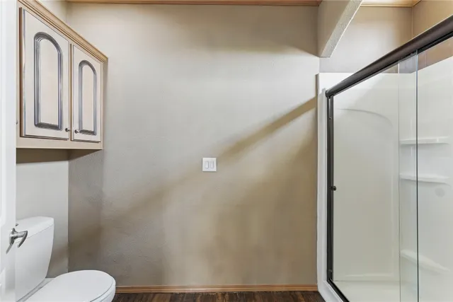 a view of a kitchen sink with cabinets