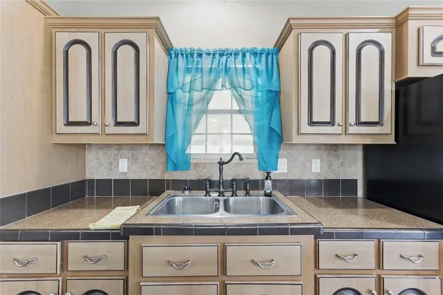 a utility room with a sink dryer and washer