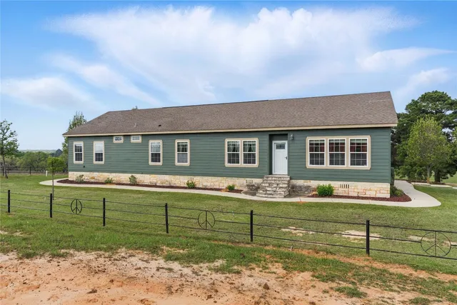 a view of a park with large trees