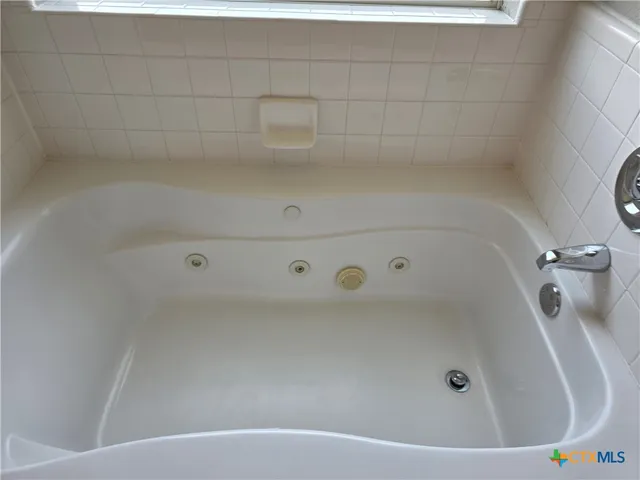 a view of a bathtub in a bathroom