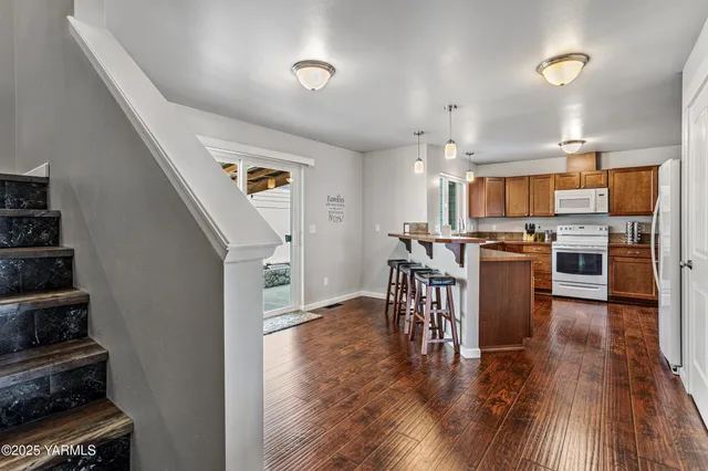 a view of a kitchen and dining room