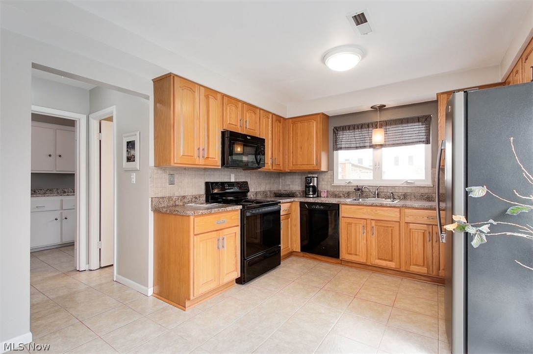 5224 Ridgebury Boulevard Cleveland, OH 44124 - Photo 11 of 21 Off of the kitchen is the laundry room, garage access, and updated powder room