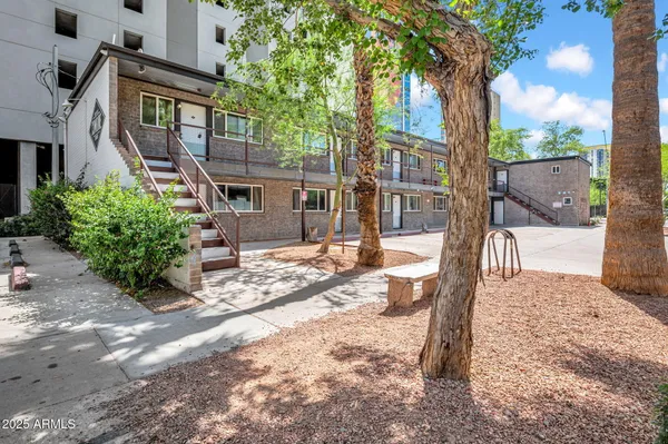 a view of a backyard with a patio