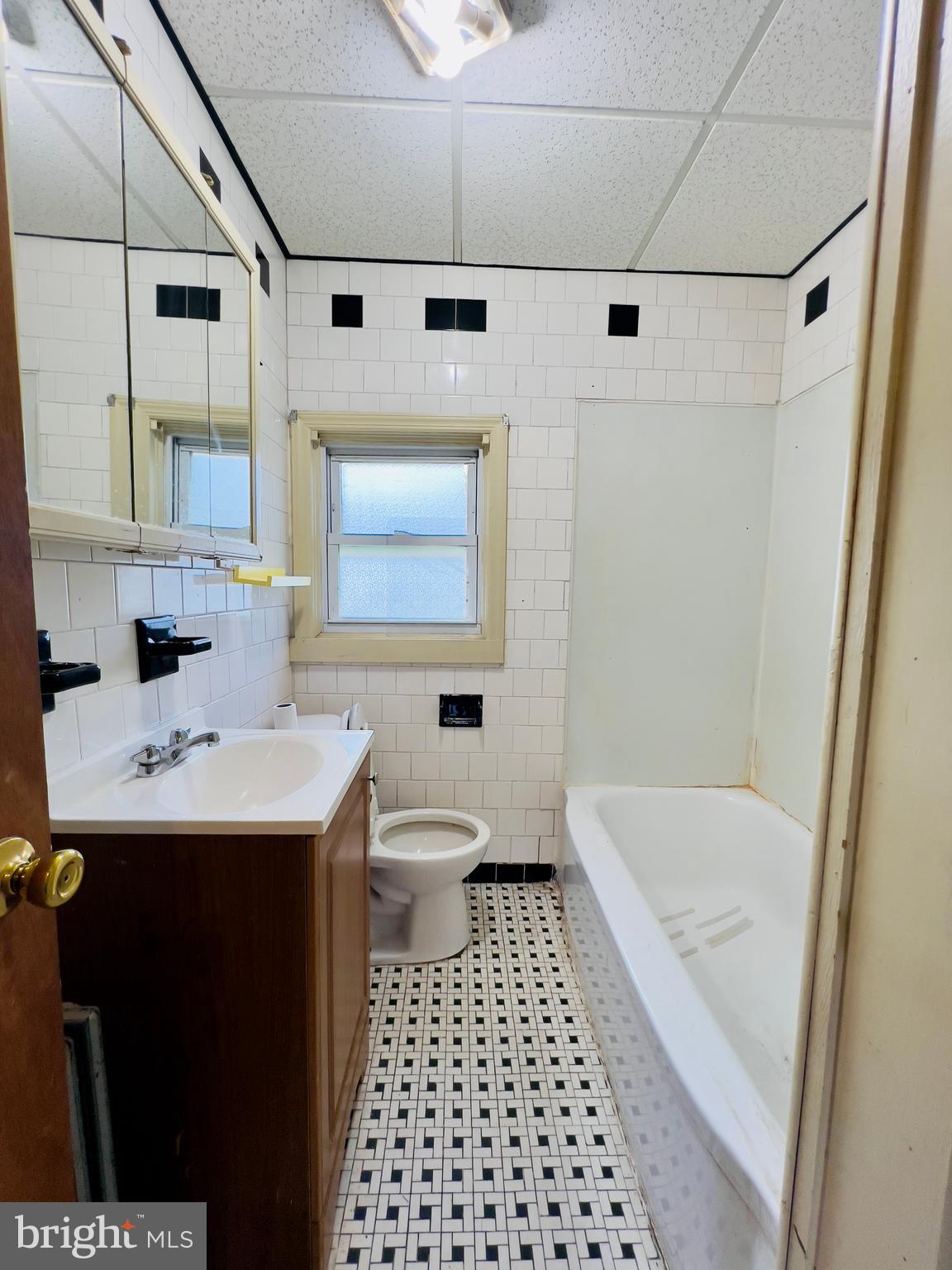 577 3rd Vineland, NJ 08360 - Photo 11 of 14 a bathroom with a sink a toilet and shower