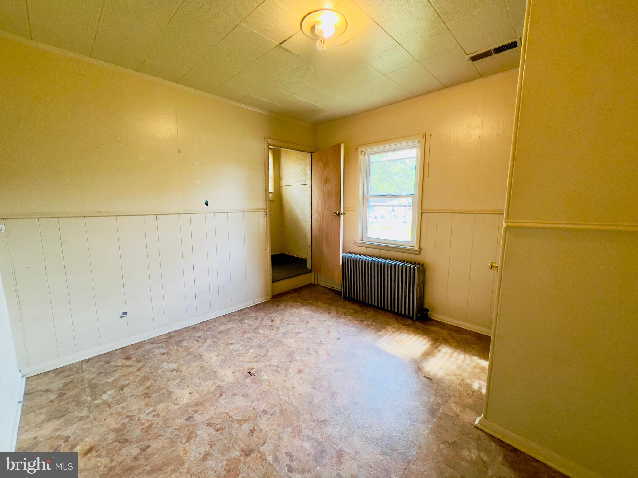 577 3rd Vineland, NJ 08360 - Photo 13 of 14 a view of an empty room with a window