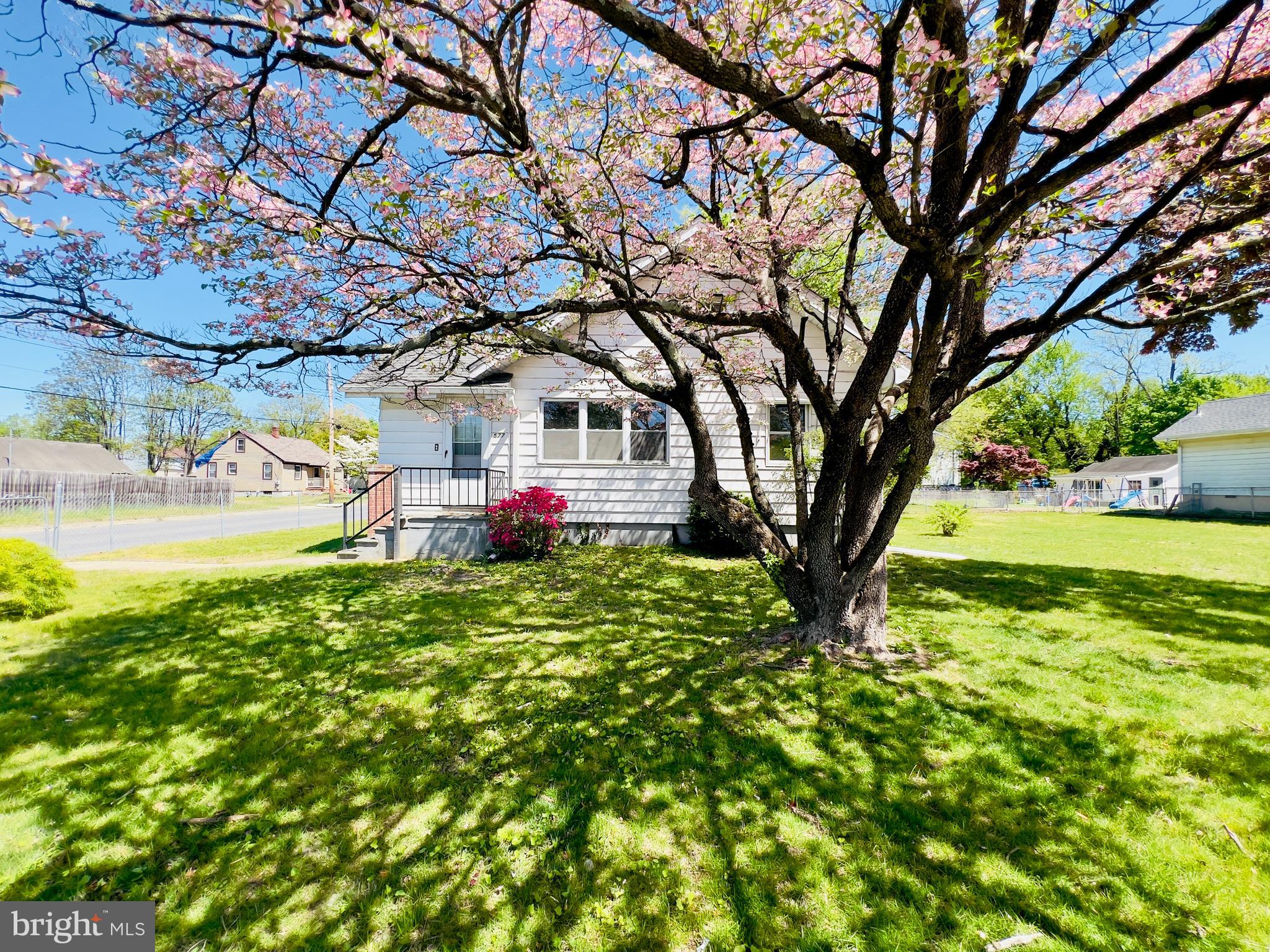 577 3rd Vineland, NJ 08360 - Photo 2 of 14 a front view of a house with garden