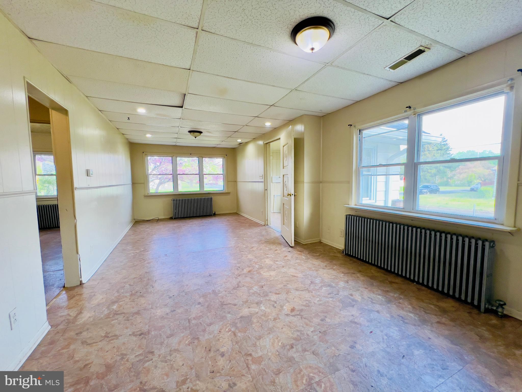 577 3rd Vineland, NJ 08360 - Photo 9 of 14 a view of livingroom with an empty room and windows