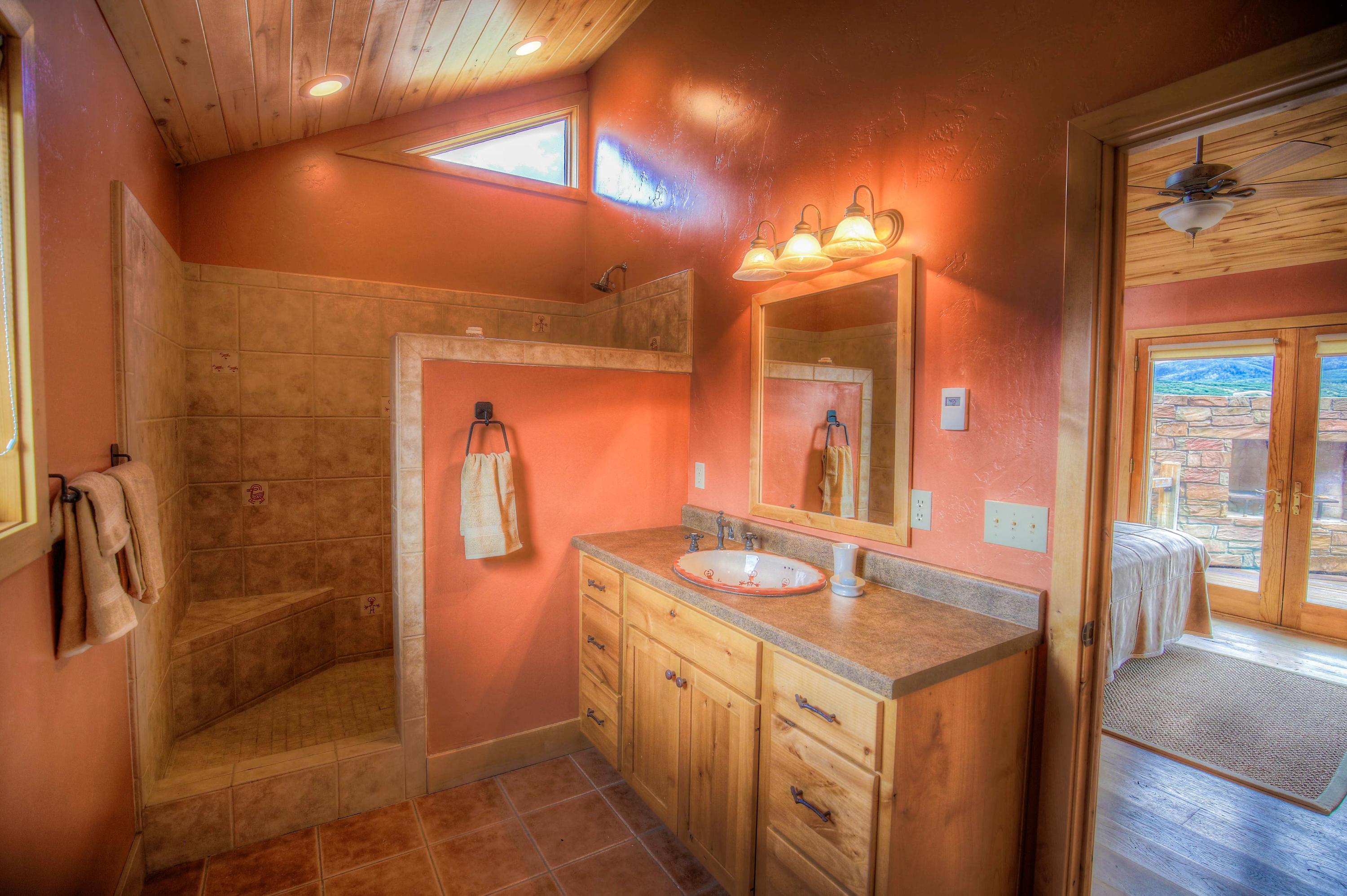 390 Peninsula Drive Placerville, CO 81430 - Photo 19 of 37 a bathroom with a sink a toilet and shower