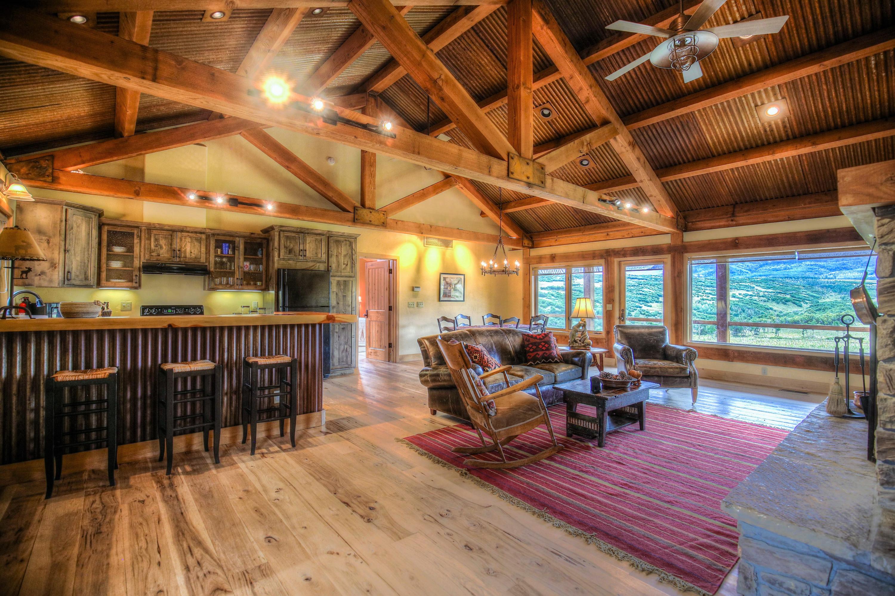 390 Peninsula Drive Placerville, CO 81430 - Photo 3 of 37 a living room with furniture wooden floor and windows