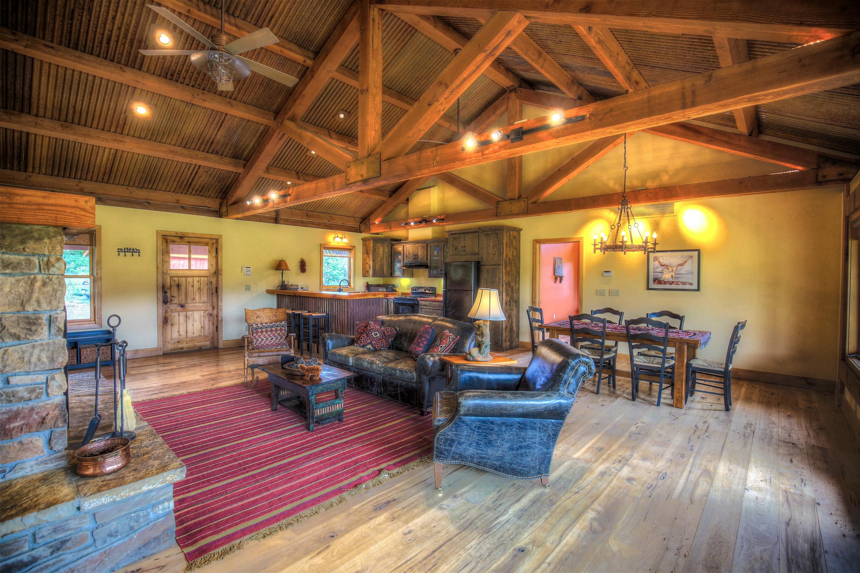 390 Peninsula Drive Placerville, CO 81430 - Photo 7 of 37 a living room with furniture and a wooden floor