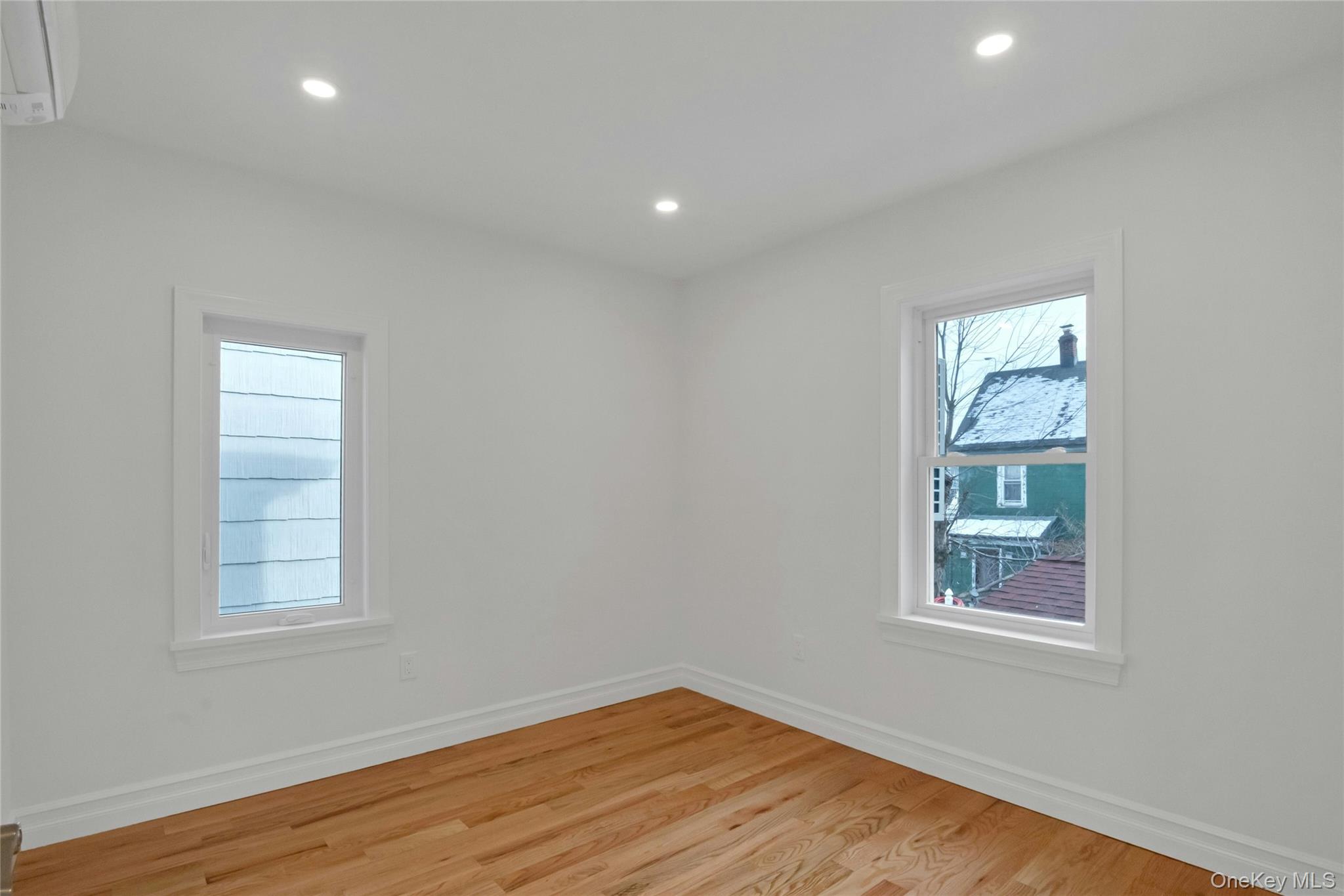 25 Walnut Street New Rochelle, NY 10801 - Photo 15 of 29 an empty room with windows