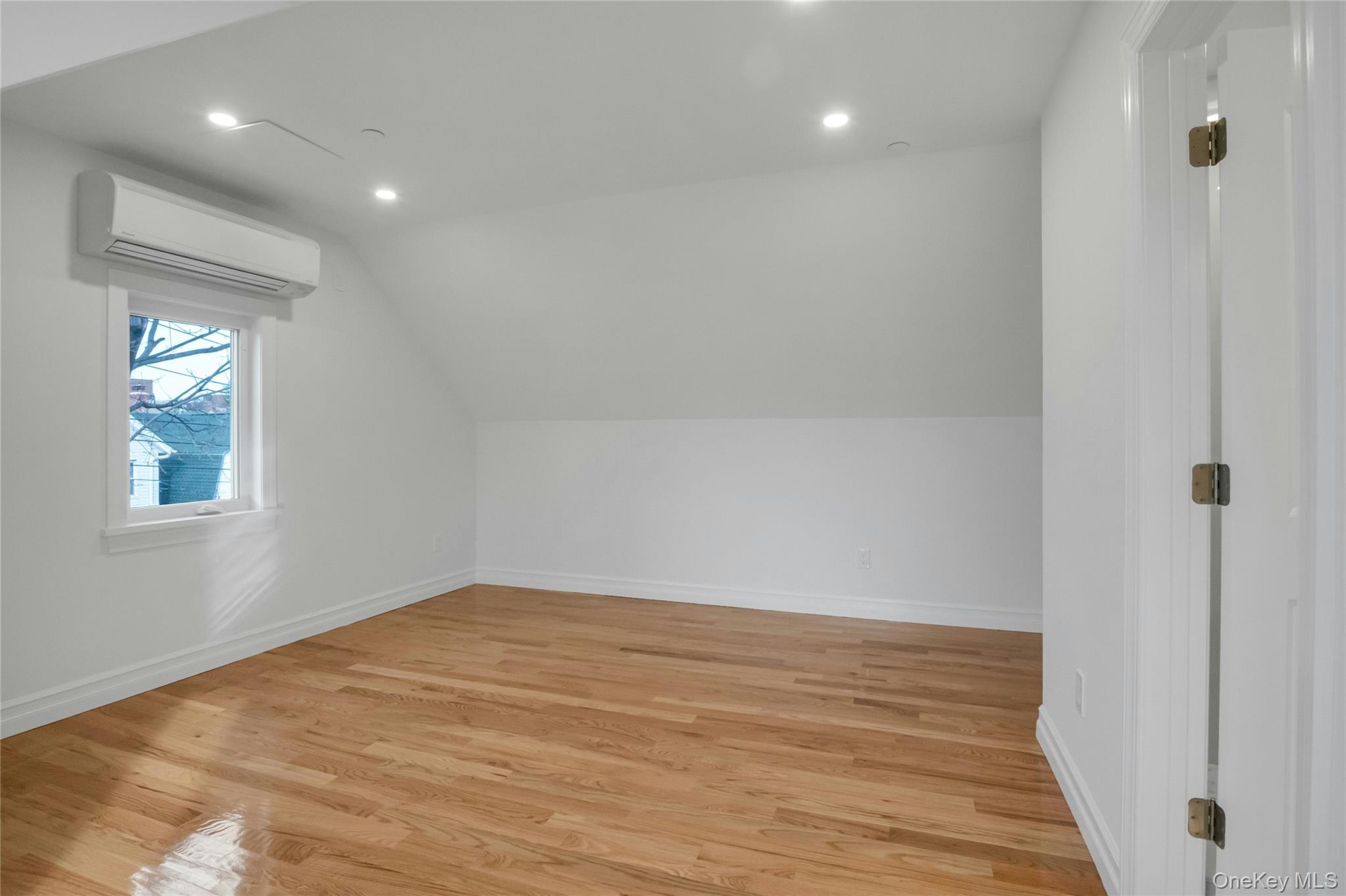 25 Walnut Street New Rochelle, NY 10801 - Photo 18 of 29 a view of room with window and hardwood floor