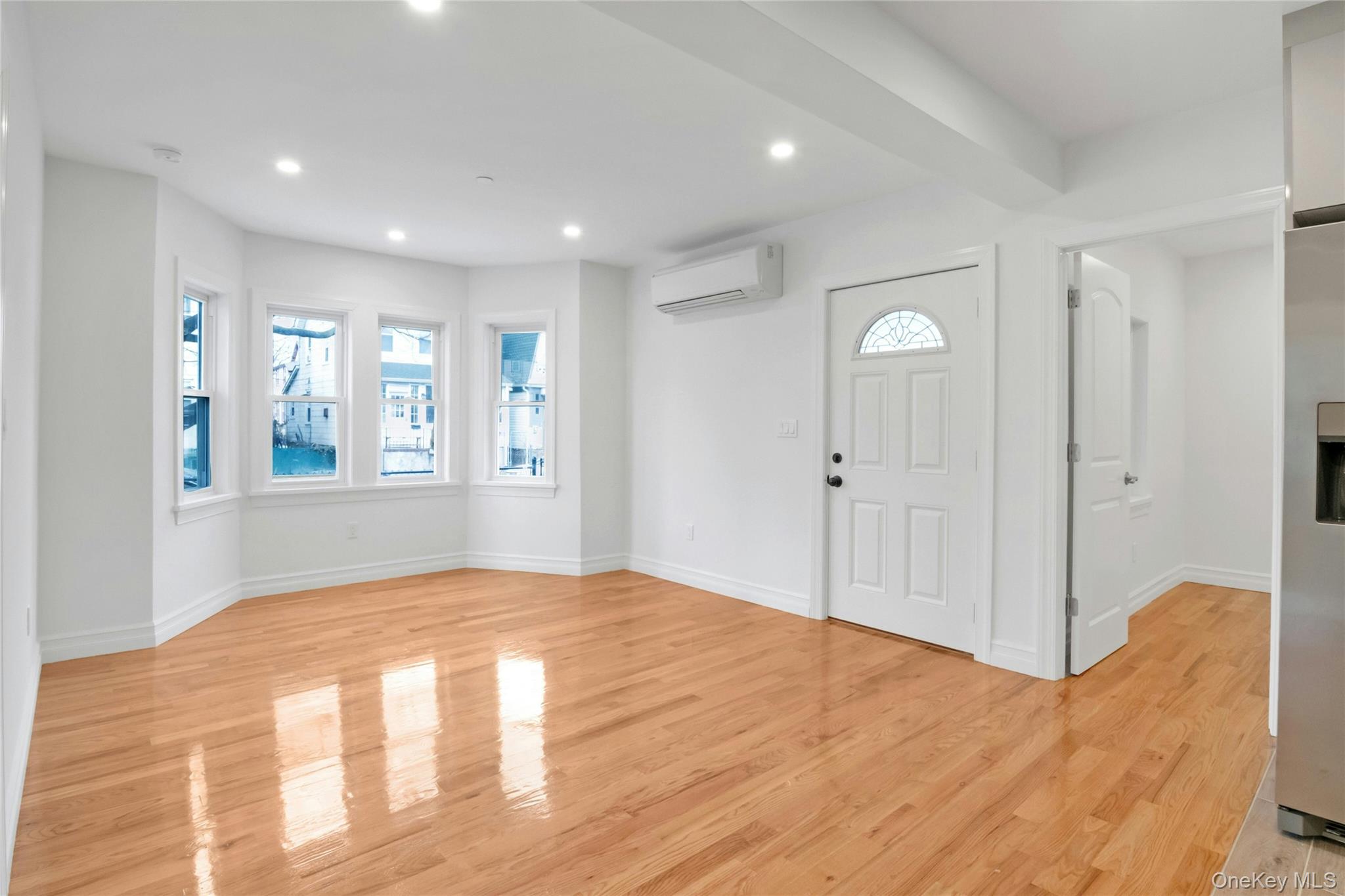 25 Walnut Street New Rochelle, NY 10801 - Photo 4 of 29 a view of an empty room and window