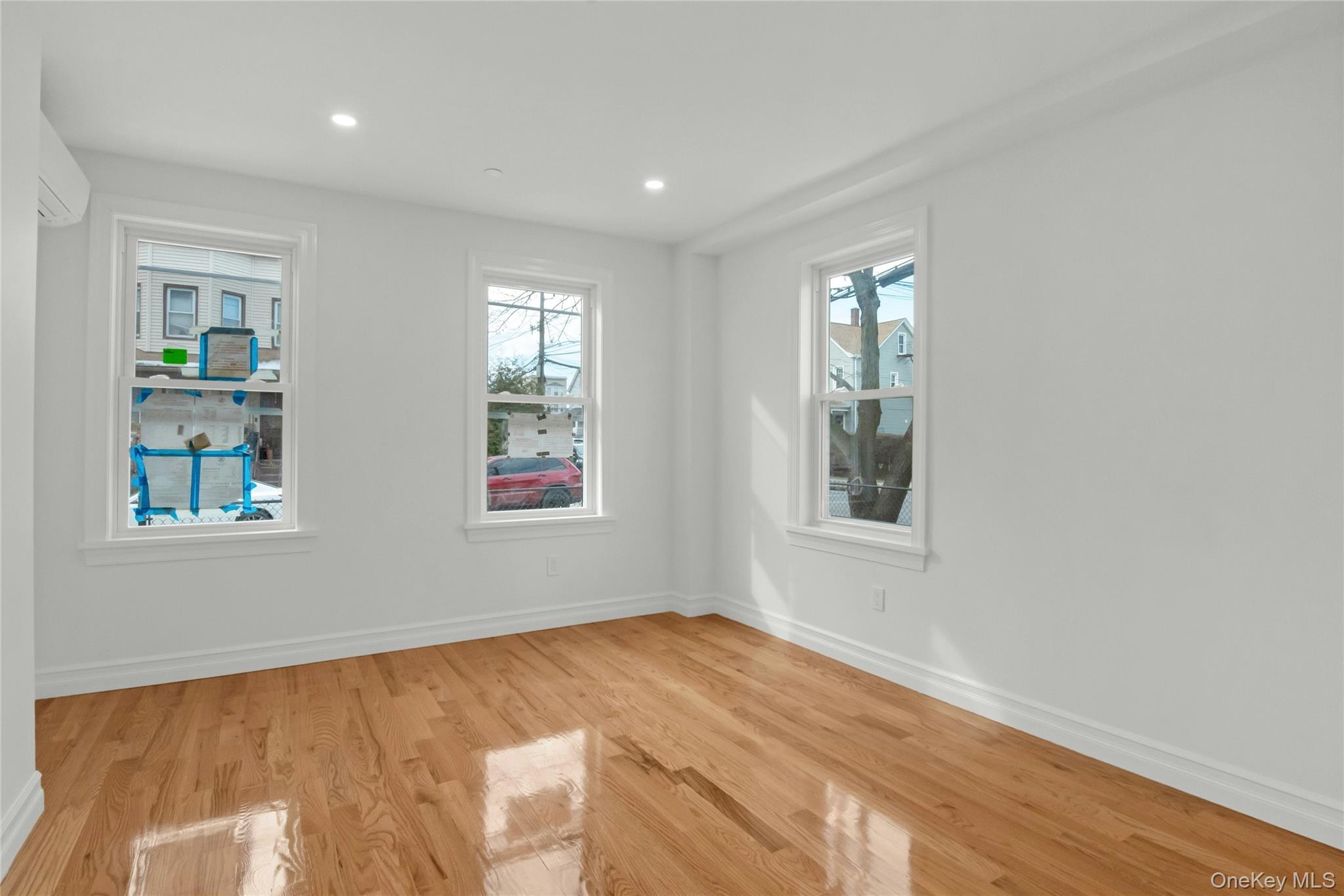 25 Walnut Street New Rochelle, NY 10801 - Photo 8 of 29 a view of an empty room with wooden floor and a window