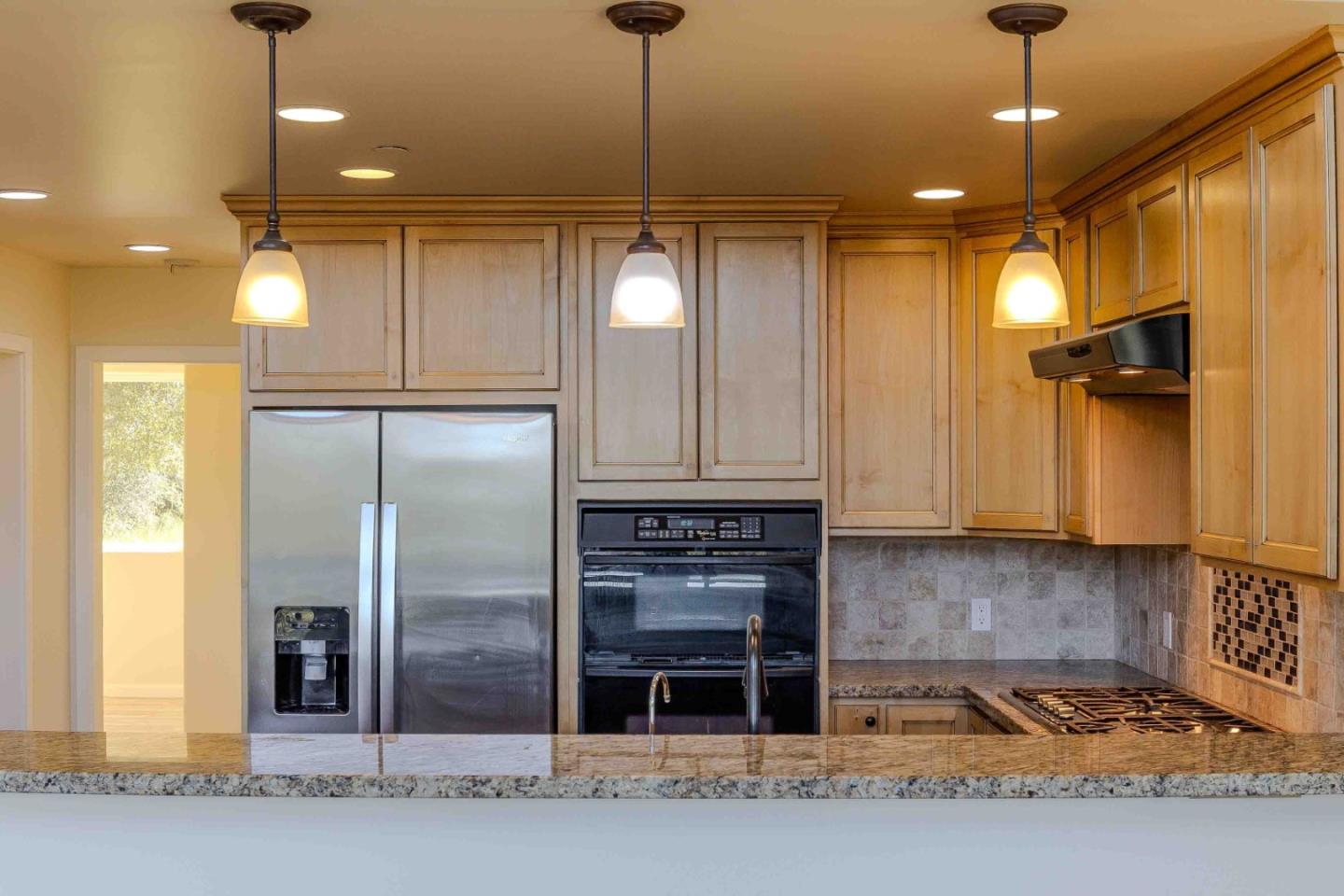 20510 Cachagua Road Carmel Valley, CA 93924 - Photo 15 of 45 a kitchen with refrigerator and window