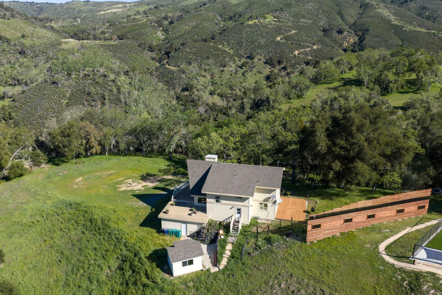 20510 Cachagua Road Carmel Valley, CA 93924 - Photo 28 of 45 an aerial view of a house with garden space and street view