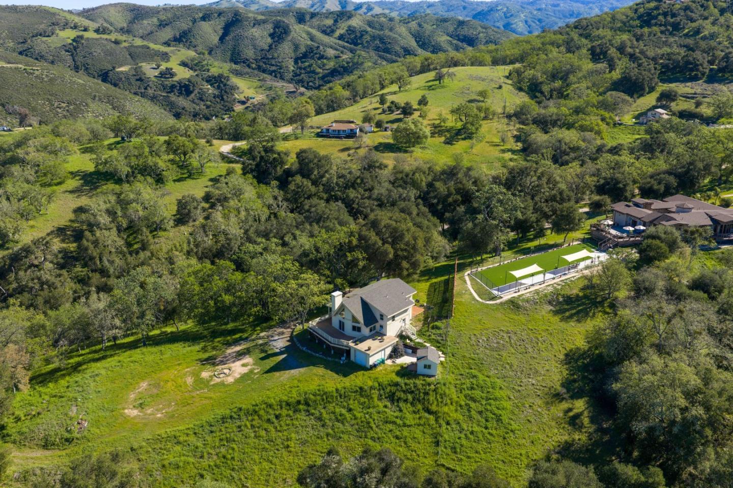 20510 Cachagua Road Carmel Valley, CA 93924 - Photo 33 of 45 a view of a houses with a yard