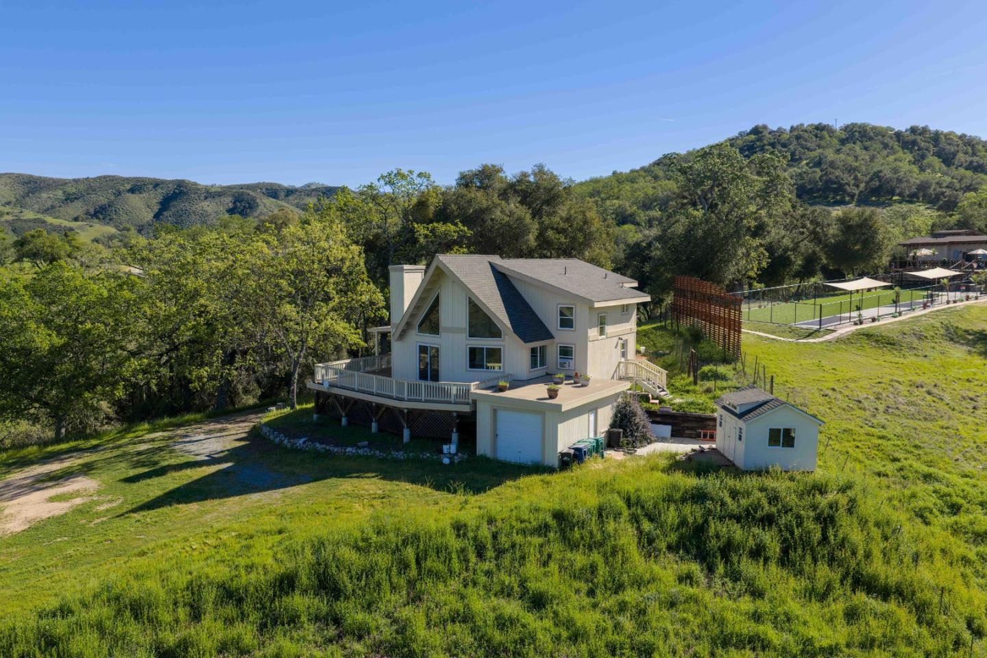 20510 Cachagua Road Carmel Valley, CA 93924 - Photo 4 of 45 an aerial view of a house with swimming pool a yard and mountain view