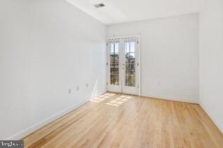 724 South Wolfe Street, Unit 4B Baltimore, MD 21231 - Photo 6 of 9 Bright and airy space with balcony access.