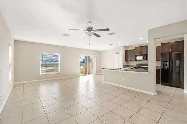 a view of a kitchen with furniture and an open kitchen view