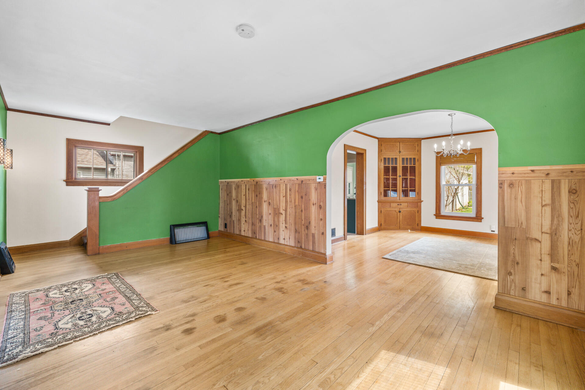 415 South Concord Road Oconomowoc, WI 53066 - Photo 7 of 39 Living room opens to the dining room, creating a comfortable flow for both everyday living and entertaining.