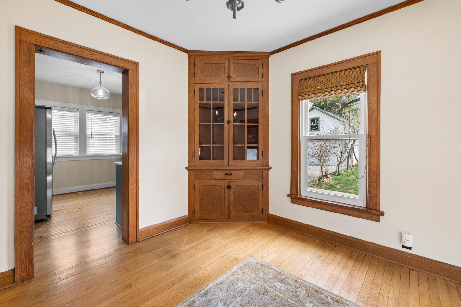 415 South Concord Road Oconomowoc, WI 53066 - Photo 12 of 39 Dining room built-in cabinet adds charm along with practical storage and display.